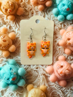 Brinco infantil - urso laranja BI01